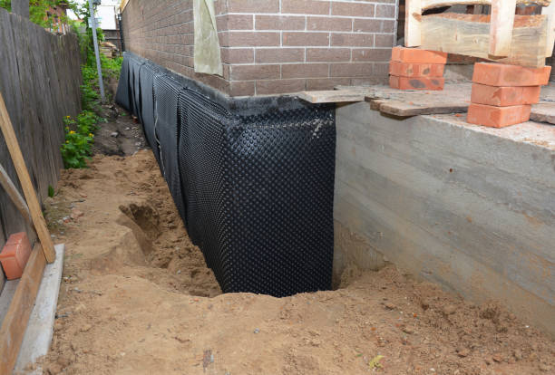 SJ Waterproofing Pros technician performing targeted Wet Basement Repair assessment in Fort Washington, MD